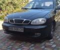 Черный Дэу Ланос, объемом двигателя 1.5 л и пробегом 156 тыс. км за 2000 $, фото 1 на Automoto.ua