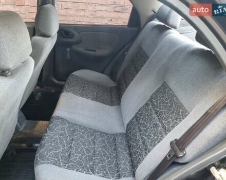 Черный Дэу Ланос, объемом двигателя 1.6 л и пробегом 139 тыс. км за 2350 $, фото 5 на Automoto.ua