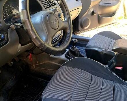 Черный Дэу Ланос, объемом двигателя 1.5 л и пробегом 365 тыс. км за 2000 $, фото 4 на Automoto.ua