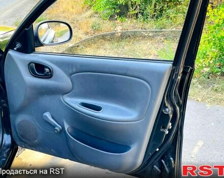 Черный Дэу Ланос, объемом двигателя 1.4 л и пробегом 303 тыс. км за 1199 $, фото 6 на Automoto.ua