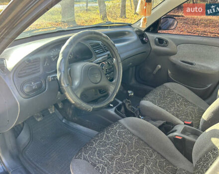 Черный Дэу Ланос, объемом двигателя 1.5 л и пробегом 152 тыс. км за 1550 $, фото 6 на Automoto.ua