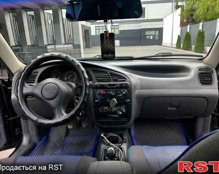 Черный Дэу Ланос, объемом двигателя 1.6 л и пробегом 120 тыс. км за 3000 $, фото 5 на Automoto.ua