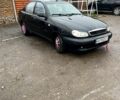 Черный Дэу Ланос, объемом двигателя 1.4 л и пробегом 202 тыс. км за 1400 $, фото 1 на Automoto.ua