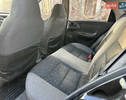 Черный Дэу Ланос, объемом двигателя 1.4 л и пробегом 220 тыс. км за 1450 $, фото 6 на Automoto.ua