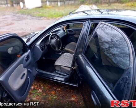 Чорний Деу Ланос, об'ємом двигуна 1.4 л та пробігом 150 тис. км за 1300 $, фото 1 на Automoto.ua