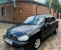 Черный Дэу Ланос, объемом двигателя 1.5 л и пробегом 152 тыс. км за 2550 $, фото 1 на Automoto.ua
