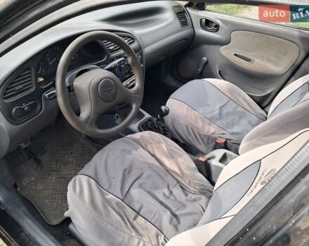 Черный Дэу Ланос, объемом двигателя 1.5 л и пробегом 300 тыс. км за 1900 $, фото 2 на Automoto.ua