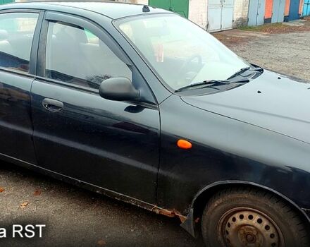 Черный Дэу Ланос, объемом двигателя 1.4 л и пробегом 222 тыс. км за 1400 $, фото 3 на Automoto.ua