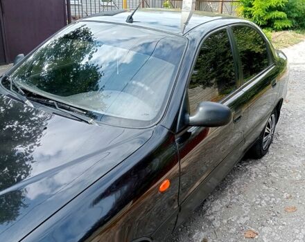 Черный Дэу Ланос, объемом двигателя 1.5 л и пробегом 213 тыс. км за 2400 $, фото 1 на Automoto.ua