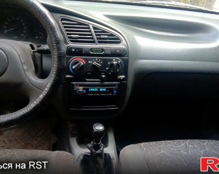 Черный Дэу Ланос, объемом двигателя 1.5 л и пробегом 276 тыс. км за 2000 $, фото 4 на Automoto.ua