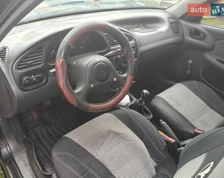 Черный Дэу Ланос, объемом двигателя 1.5 л и пробегом 117 тыс. км за 2800 $, фото 3 на Automoto.ua