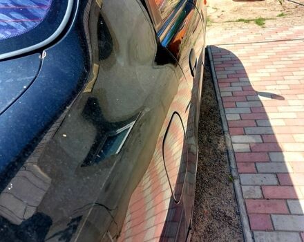 Черный Дэу Ланос, объемом двигателя 1.5 л и пробегом 217 тыс. км за 1800 $, фото 1 на Automoto.ua