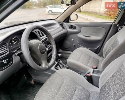 Черный Дэу Ланос, объемом двигателя 1.5 л и пробегом 351 тыс. км за 2000 $, фото 5 на Automoto.ua