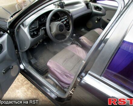 Черный Дэу Ланос, объемом двигателя 1.5 л и пробегом 230 тыс. км за 2000 $, фото 8 на Automoto.ua