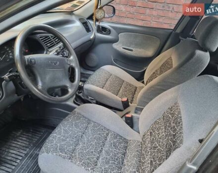 Черный Дэу Ланос, объемом двигателя 1.6 л и пробегом 139 тыс. км за 2350 $, фото 9 на Automoto.ua