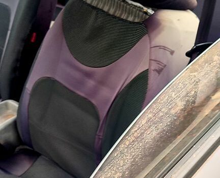 Черный Дэу Ланос, объемом двигателя 1.4 л и пробегом 222 тыс. км за 1400 $, фото 4 на Automoto.ua