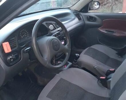 Черный Дэу Ланос, объемом двигателя 1.5 л и пробегом 180 тыс. км за 2250 $, фото 2 на Automoto.ua