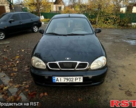 Черный Дэу Ланос, объемом двигателя 1.4 л и пробегом 220 тыс. км за 1800 $, фото 1 на Automoto.ua