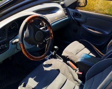 Черный Дэу Ланос, объемом двигателя 1.5 л и пробегом 240 тыс. км за 3300 $, фото 2 на Automoto.ua