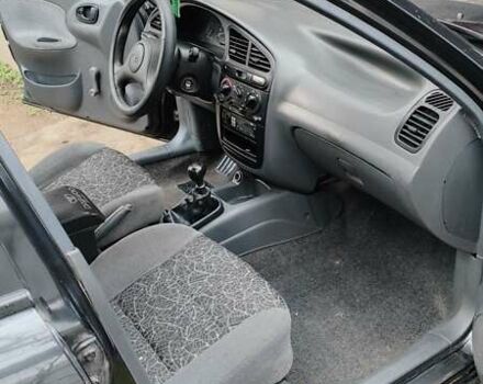 Черный Дэу Ланос, объемом двигателя 1.5 л и пробегом 130 тыс. км за 2700 $, фото 6 на Automoto.ua