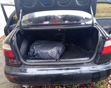 Черный Дэу Ланос, объемом двигателя 1.5 л и пробегом 180 тыс. км за 2300 $, фото 1 на Automoto.ua