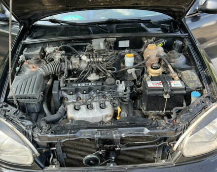 Черный Дэу Ланос, объемом двигателя 1.5 л и пробегом 300 тыс. км за 2400 $, фото 3 на Automoto.ua