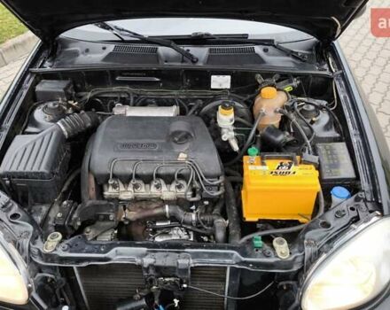 Черный Дэу Ланос, объемом двигателя 1.39 л и пробегом 213 тыс. км за 2300 $, фото 4 на Automoto.ua