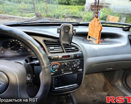 Чорний Деу Ланос, об'ємом двигуна 1.5 л та пробігом 240 тис. км за 1650 $, фото 2 на Automoto.ua