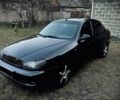 Черный Дэу Ланос, объемом двигателя 1.5 л и пробегом 213 тыс. км за 3000 $, фото 1 на Automoto.ua