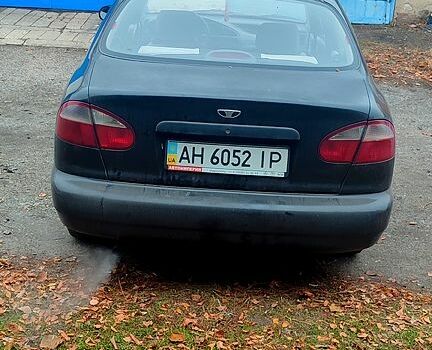 Черный Дэу Ланос, объемом двигателя 1.4 л и пробегом 222 тыс. км за 1400 $, фото 2 на Automoto.ua