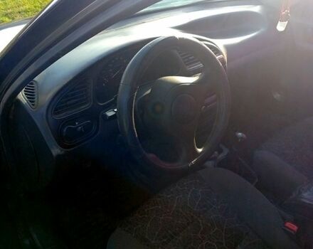 Черный Дэу Ланос, объемом двигателя 1.5 л и пробегом 286 тыс. км за 1000 $, фото 1 на Automoto.ua