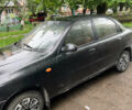 Черный Дэу Ланос, объемом двигателя 1.4 л и пробегом 260 тыс. км за 1200 $, фото 1 на Automoto.ua
