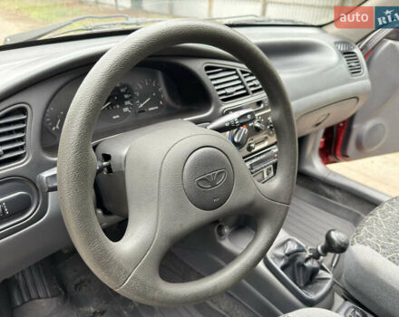 Черный Дэу Ланос, объемом двигателя 1.6 л и пробегом 156 тыс. км за 2400 $, фото 22 на Automoto.ua