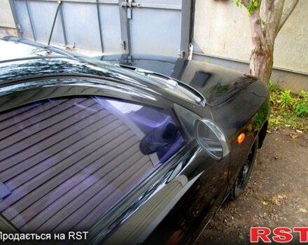 Черный Дэу Ланос, объемом двигателя 1.5 л и пробегом 230 тыс. км за 2000 $, фото 4 на Automoto.ua