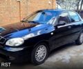 Черный Дэу Ланос, объемом двигателя 1.5 л и пробегом 300 тыс. км за 2700 $, фото 1 на Automoto.ua
