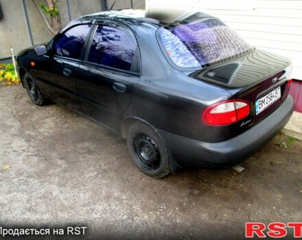 Черный Дэу Ланос, объемом двигателя 1.5 л и пробегом 230 тыс. км за 2000 $, фото 3 на Automoto.ua