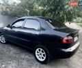 Черный Дэу Ланос, объемом двигателя 1.6 л и пробегом 160 тыс. км за 3150 $, фото 3 на Automoto.ua