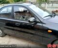 Черный Дэу Ланос, объемом двигателя 1.4 л и пробегом 144 тыс. км за 2100 $, фото 2 на Automoto.ua