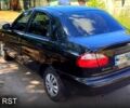 Черный Дэу Ланос, объемом двигателя 1.5 л и пробегом 114 тыс. км за 3000 $, фото 1 на Automoto.ua