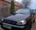 Чорний Деу Ланос, об'ємом двигуна 1.6 л та пробігом 0 тис. км за 2400 $, фото 1 на Automoto.ua