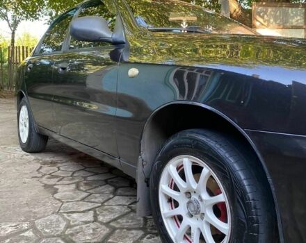 Черный Дэу Ланос, объемом двигателя 1.5 л и пробегом 1000 тыс. км за 2600 $, фото 2 на Automoto.ua