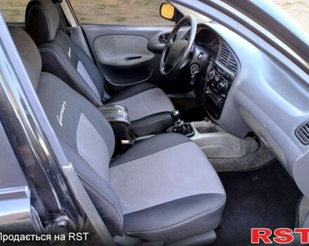 Черный Дэу Ланос, объемом двигателя 1.6 л и пробегом 160 тыс. км за 2700 $, фото 5 на Automoto.ua