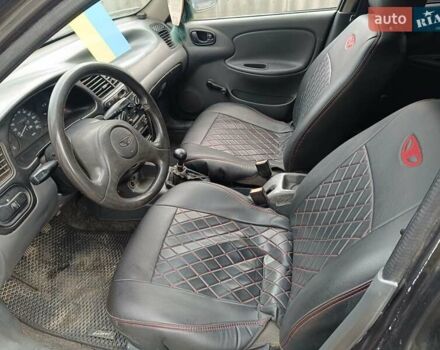 Черный Дэу Ланос, объемом двигателя 1.5 л и пробегом 200 тыс. км за 2100 $, фото 6 на Automoto.ua