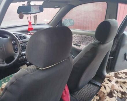 Черный Дэу Ланос, объемом двигателя 1.6 л и пробегом 262 тыс. км за 1850 $, фото 2 на Automoto.ua
