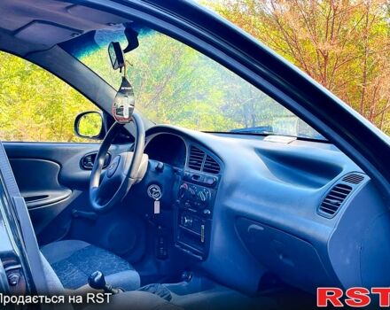 Черный Дэу Ланос, объемом двигателя 1.4 л и пробегом 303 тыс. км за 1199 $, фото 3 на Automoto.ua