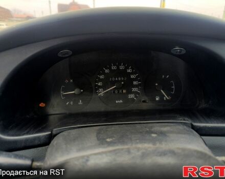 Черный Дэу Ланос, объемом двигателя 1.5 л и пробегом 220 тыс. км за 1000 $, фото 5 на Automoto.ua