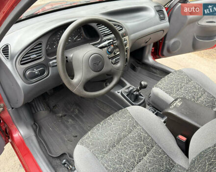 Черный Дэу Ланос, объемом двигателя 1.6 л и пробегом 156 тыс. км за 2400 $, фото 6 на Automoto.ua