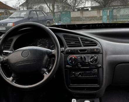 Черный Дэу Ланос, объемом двигателя 1.5 л и пробегом 200 тыс. км за 2000 $, фото 5 на Automoto.ua