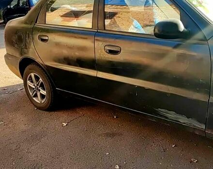 Чорний Деу Ланос, об'ємом двигуна 1.4 л та пробігом 0 тис. км за 1300 $, фото 1 на Automoto.ua