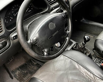 Черный Дэу Ланос, объемом двигателя 1.5 л и пробегом 200 тыс. км за 2000 $, фото 6 на Automoto.ua